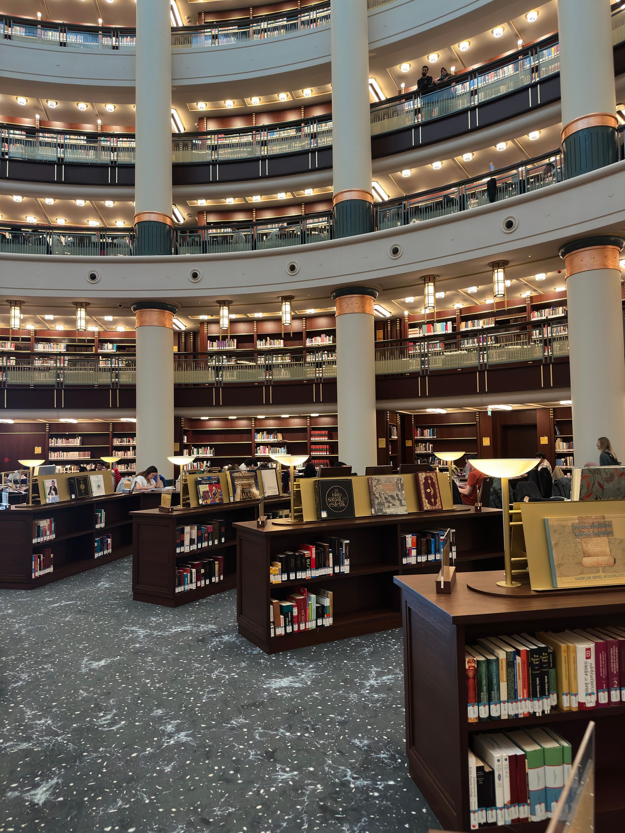 Research library with books and a long reading table.